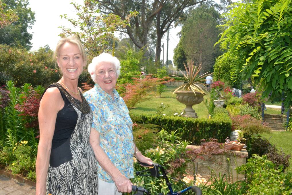 Alison and Iris Mackinnon from Berry enjoy garden number five at the Berry Garden Festival on Saturday.