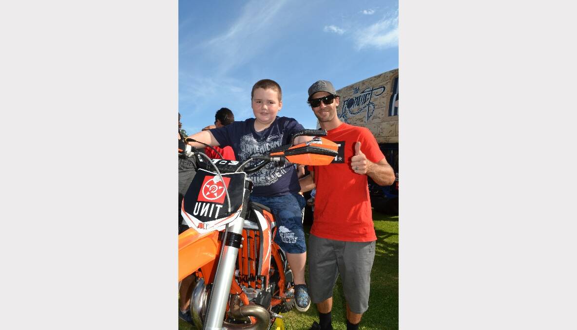 REVVING UP: Matt Schubring from Sanctuary Point has a turn on the motorcross bike with Connor Sumners from Boonah at the Monster Trucks Family Spectacular