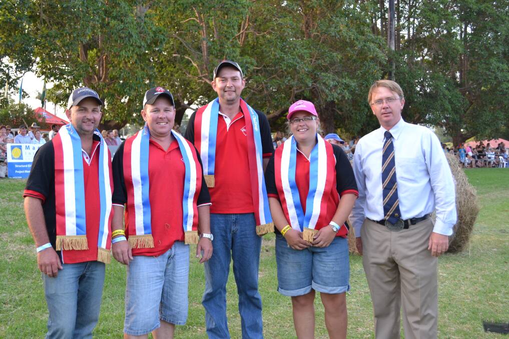YOUNG GUNS: Matt Warnes, Brad Gavenlock, Justin Walsh and Renee Warnes are presented with their winning ribbons by John Bennett representing Royal Agricultural Society of NSW. Their team ‘Diamond Genetics Australia’ won the Young Farmers Challenge at the Berry Show on Saturday.