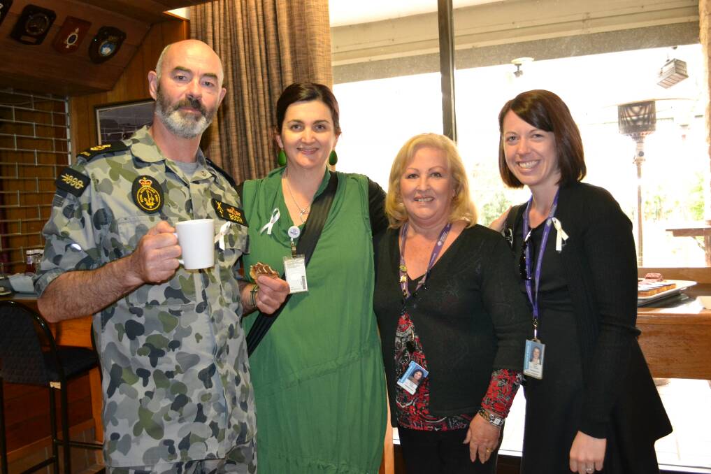 SPECIAL EVENT: Rich Booth, Rachel Martin, Joan Gooey and Jessica Charlton took part in the HMAS Albatross White Ribbon Day morning tea on Monday.