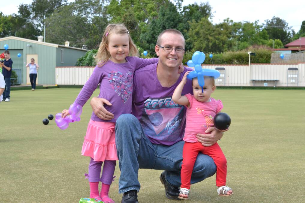 FAMILY FUN: Evie, Michael and Paige Starkey from Worrigee joining in the fun at the Nowra Bowling Club 100th Anniversary on Sunday.
