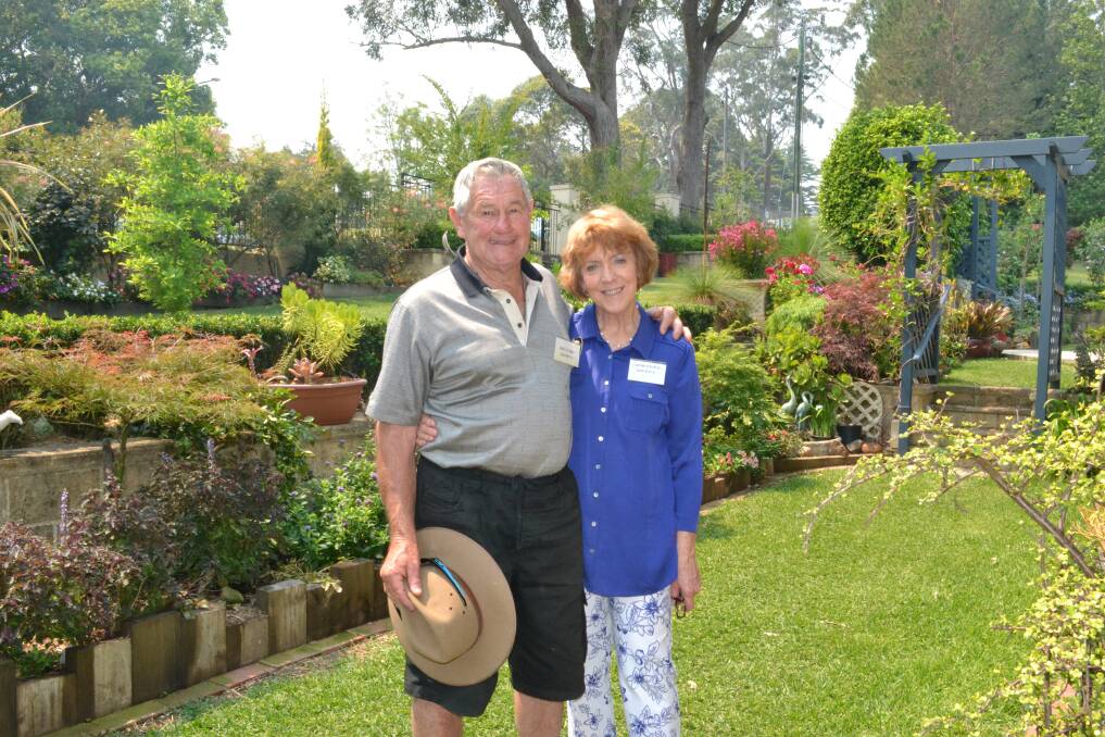 Garden number five owners Bob and Lynne Croker sit back and relax after preparing for the Berry Garden Festival on Saturday.