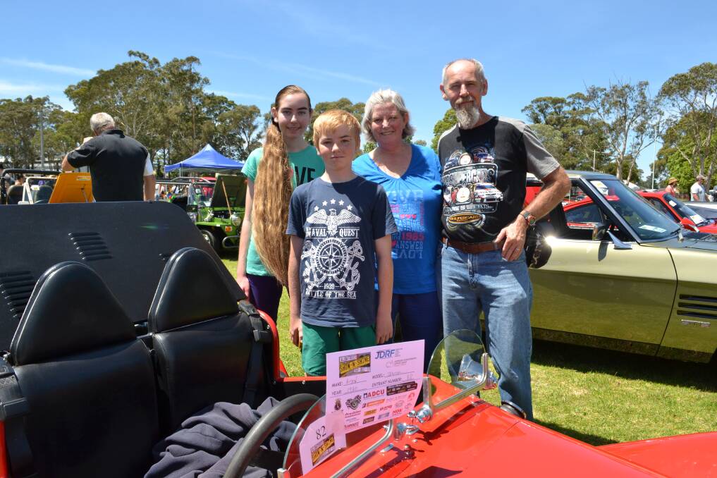 VIEWING VINTAGE CARS: At Sunday’s HMAS Albatross fund-raiser for research into juvenile diabetes and the Australian Leukodystrophy Support Group are Sanctuary Point residents Louise and Wayne Davey with children Leeanne and Jack. 