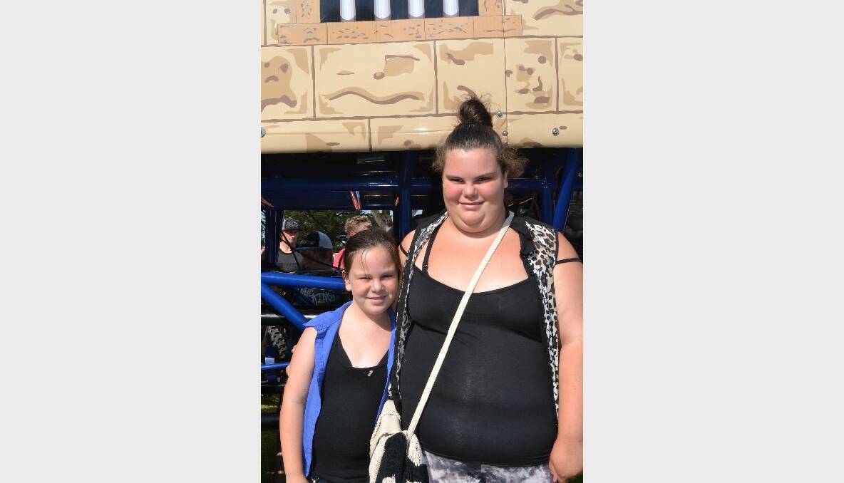 REV EM UP: Hayley and Teanna Verkroost from Sanctuary Point have a great time at the Monster Trucks Family Spectacular