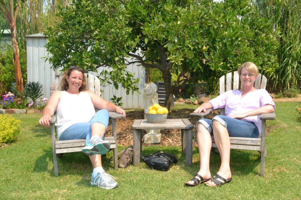 Karen Sawyers from Falls Creek and Sharyn Meers from Orient Point enjoy garden number three at the Berry Garden Festival on Saturday.