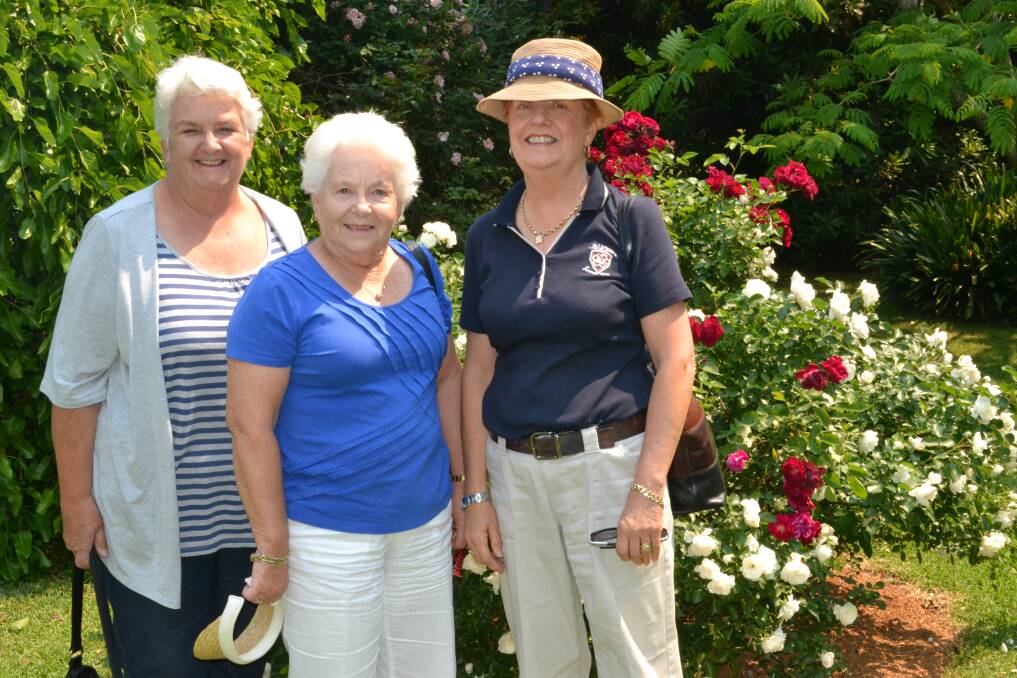 Annette Morris from Bomaderry, Jan Smart from Berry and Vicki Hutchinson from Bomaderry admire garden number two at the Berry Garden Festival on Saturday.