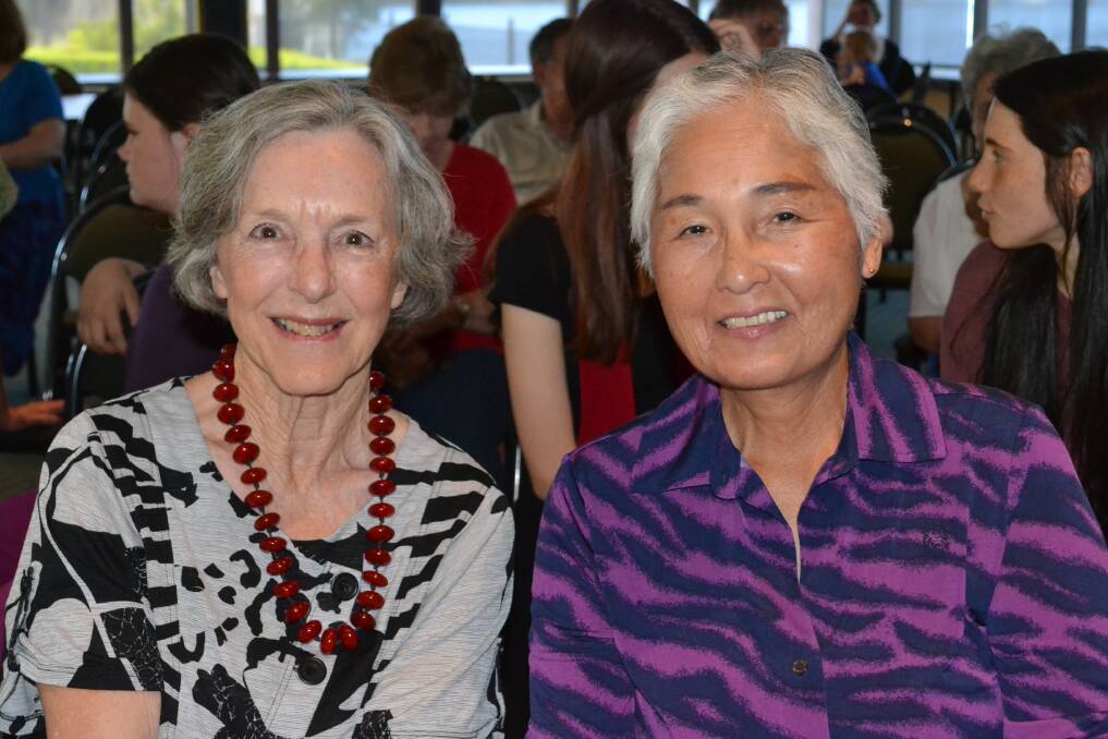 FRIENDS: Sandy Sharrock from Broughton and Yuriko Ball from Currarong enjoy a chat at the Trilogy CD launch on Sunday.