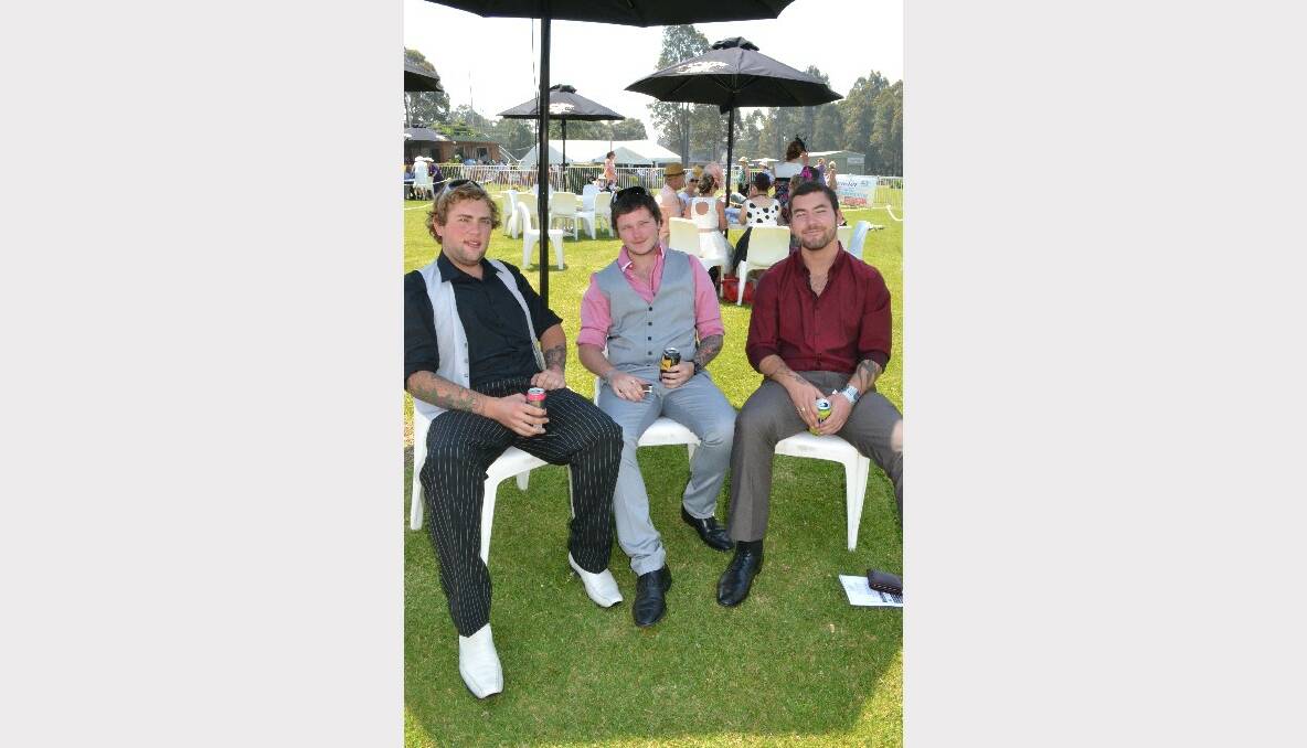 BEST HORSE: Aaron Croker, Nathan Webb and Jacob Hemsworth from Ulludulla at the Mollymook Cup pick out their favourite horse at the Shoalhaven City Turf Club on Sunday.