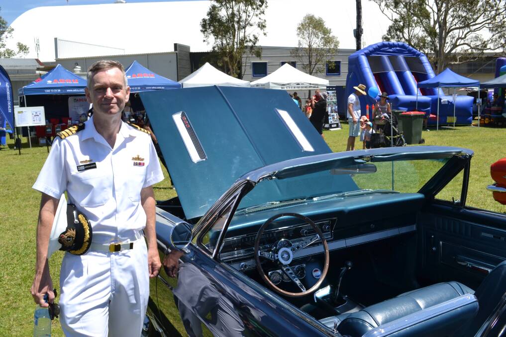 COMMANDING OFFICER: Captain Gordon Andrew, took time to look over the vintage and veteran cars on display at the base on Sunday, December 8 to help raise money for research into juvenile diabetes and the Australian Leukodystrophy Support Group. 