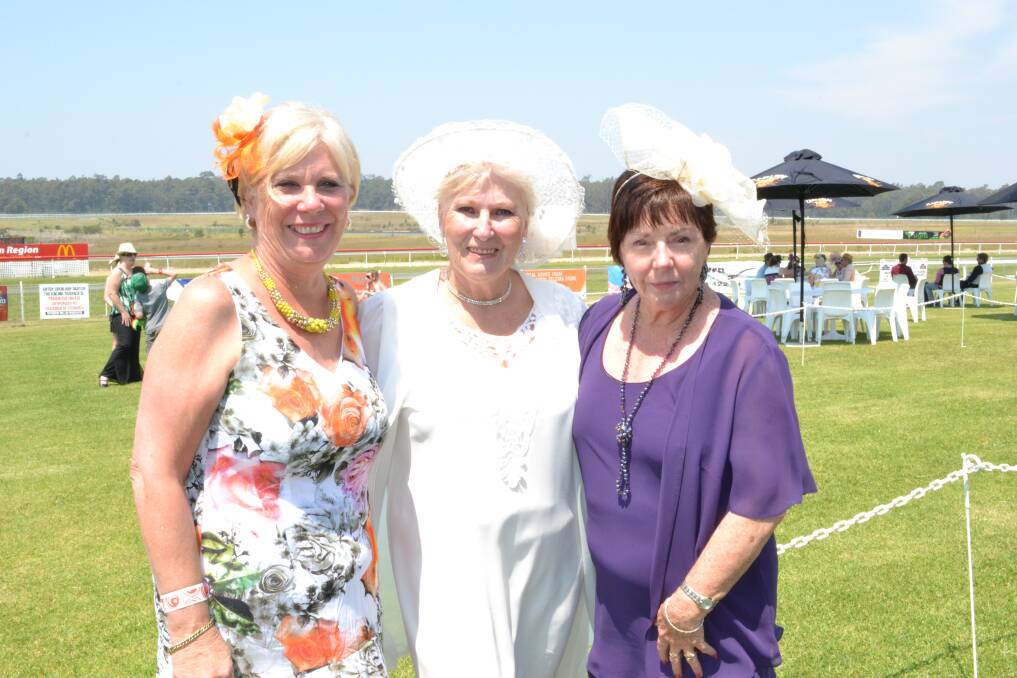 FASHION ON THE FIELD: Michelle Helson, Kerry Howes and Lynn Jackson from Sussex Inlet at the Mollymook Cup dress in their best at the Shoalhaven City Turf Club on Sunday.