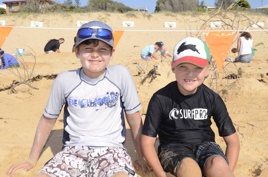 SEASIDE: Sean Barrass from Camden and Jordan Broers from Wollongong at Culburra beach for the 2014 Sand  Art competiton.
