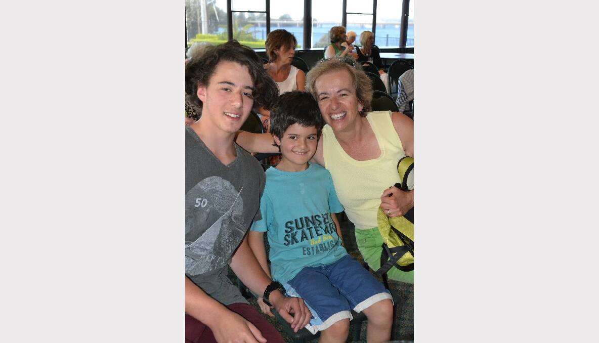 CHEER SQUAD: Josh and Samuel Neri from Cambewarra with Nadia Verrucci from Cambewarra support their singing friends at the Trilogy CD launch on Sunday.