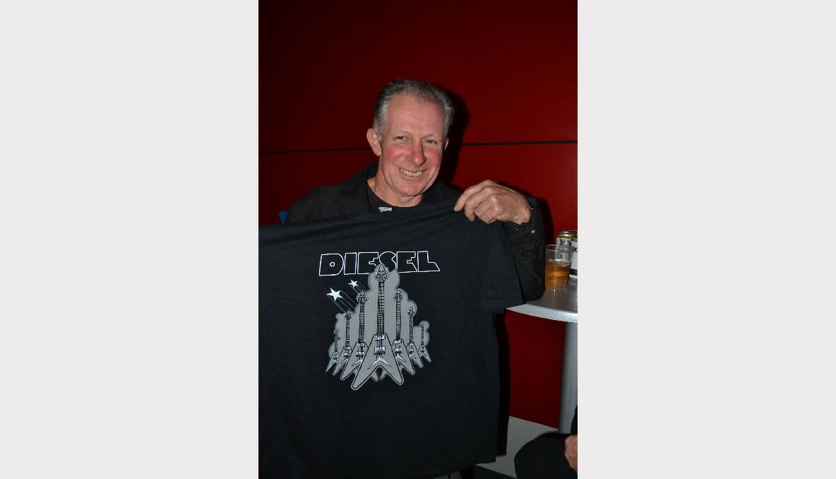 SOUVENIR: Michael Lett from Berry shows off his T-shirt souvenir at the Diesel concert at the Shoalhaven Entertainment Centre on Saturday night.