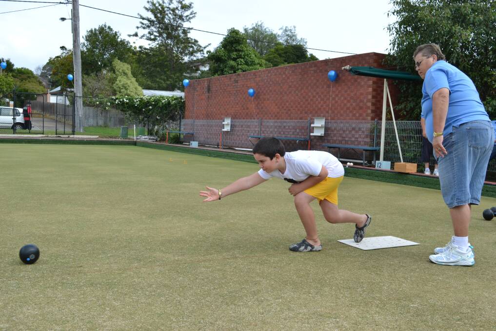YOUNG PLAYER: William White Everingham from Worrigee plays at the at the Nowra Bowling Club 100th Anniversary on Sunday.