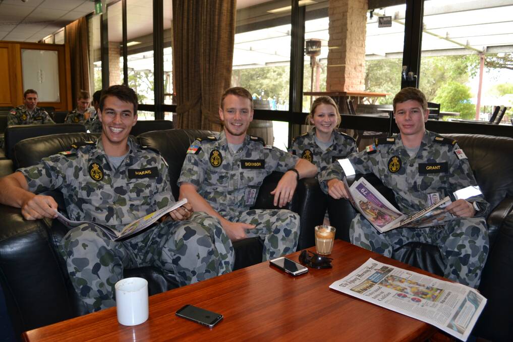 TIME OUT: Nick Marais, Will Dickinson, Maggie Twyford and Michael Grant take time out to show support for White Ribbon Day at HMAS Albatross on Monday.