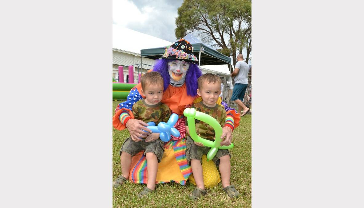 SEEING DOUBLE: Twins Lucas and Jonas Payton from Vincentia with Mumbo the clown at the Defence Family Expo Day.