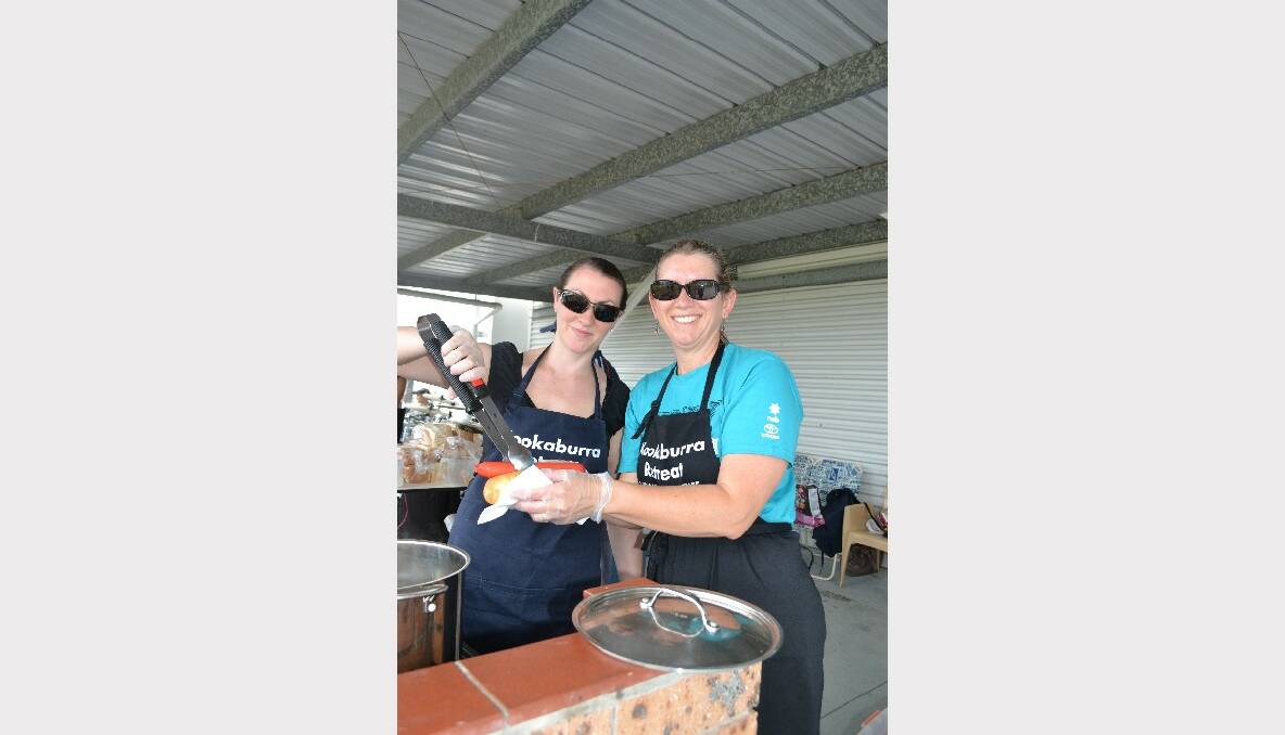 COOK UP: Emily Littlejohn and Rachel Birkmyre from Kookaburra Retreat Shoalhaven Defence Family Association cook up some treats at the Defence Family Expo Day.