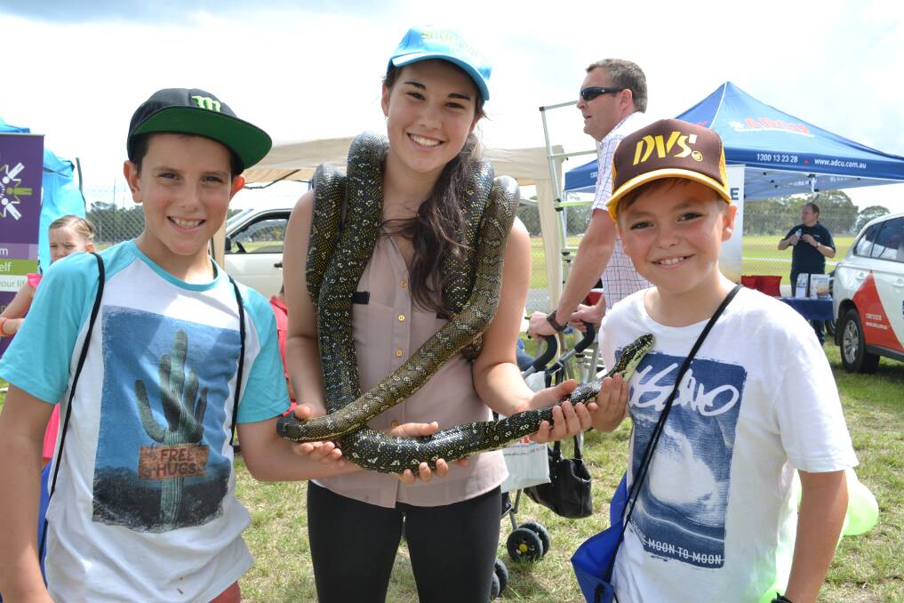 SCALEY FRIENDS: Callan Copeland from Cambewarra, Breanna Macey from Wildlife Rescue and Rhett Butler from North Nowra at the Defence Family Expo Day.