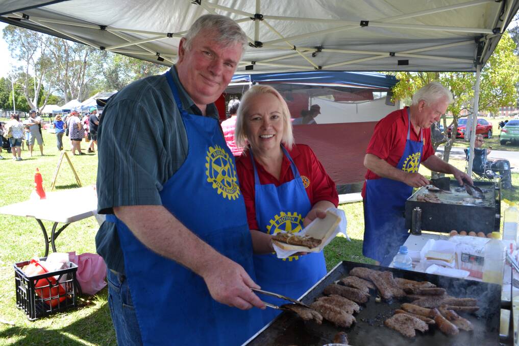 ROTARY VOLUNTEERS: Phil and Denise Mewett help out at HMAS Albatross to help raise funds for research into juvenile diabetes and the Australian Leukodystrophy Support Group on Sunday. 