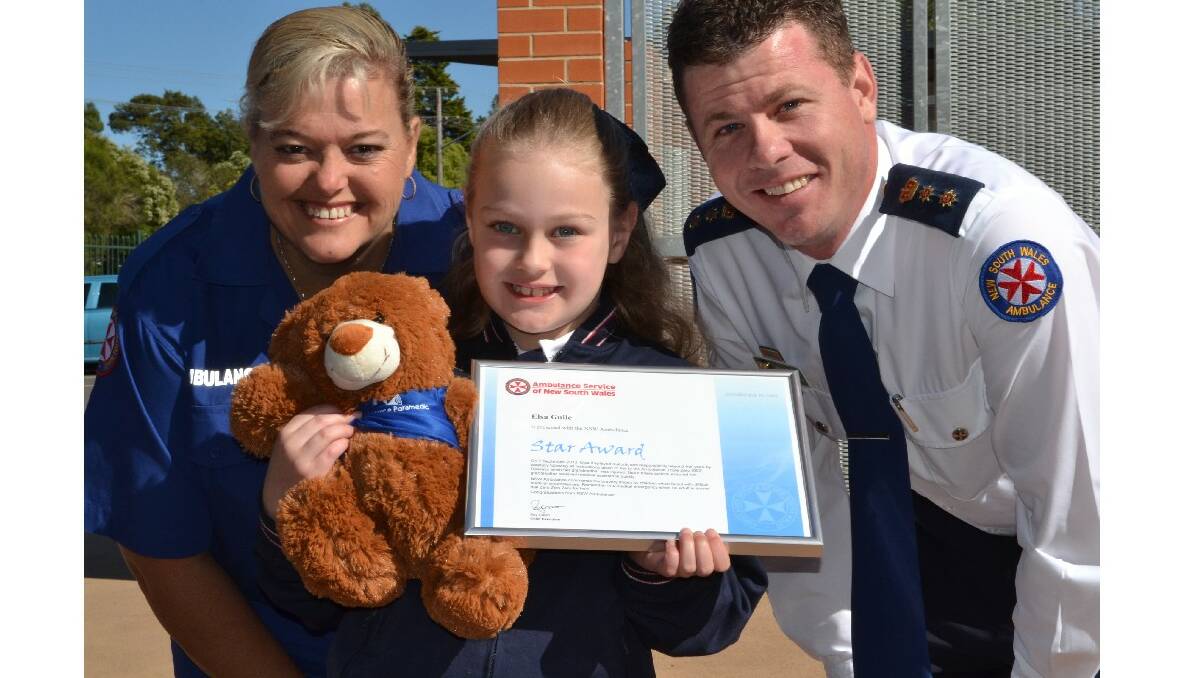Nowra Anglican College student Elsa Guile receives her NSW Ambulance Star Award from Southern Control call taker Janelle Gaskin and NSW Ambulance Chief Superintendent Joel Bardsley.