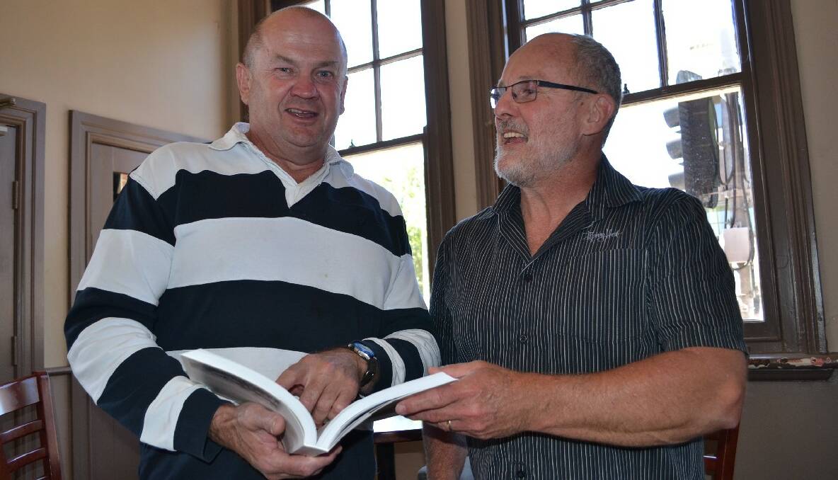 Dave Biddle and Shane Rosetto look through James Kehoe book From Whites to Muddies.