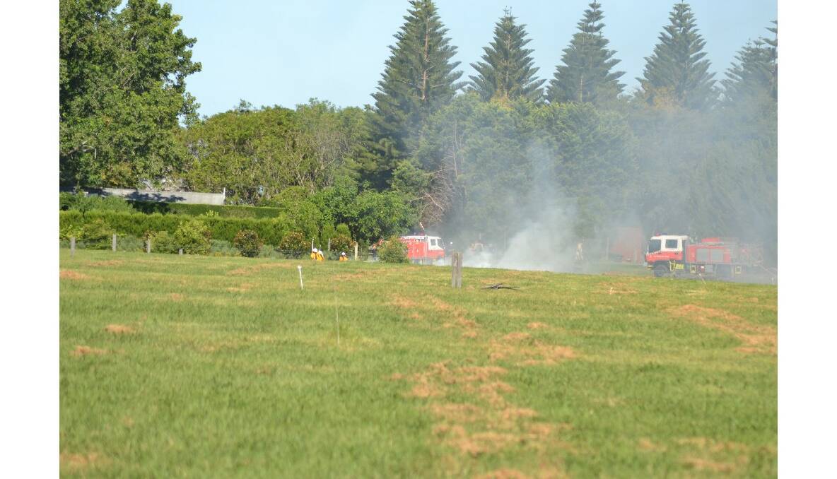 NSW Rural Fire Service crews extinguish a grass fire at the historic Terrara House property east of Nowra.