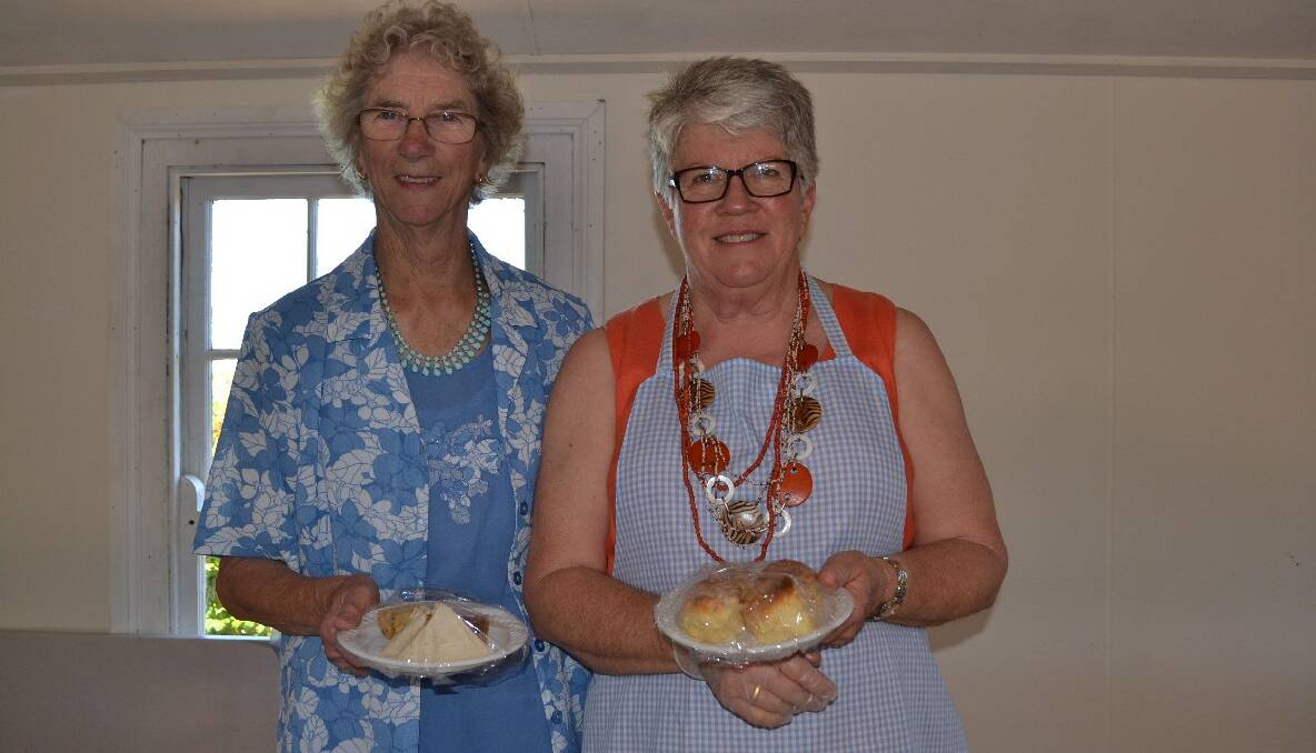 Marion Bone and Janet Mottram prepare food for the Nowra Presbyterian Women’s Association 1000 Roses Beautiful Garden morning tea.
