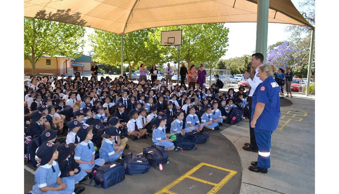 Nowra Anglican College student and NSW Ambulance Star Award recipient Elsa Guile receives her award in front of her fellow students.