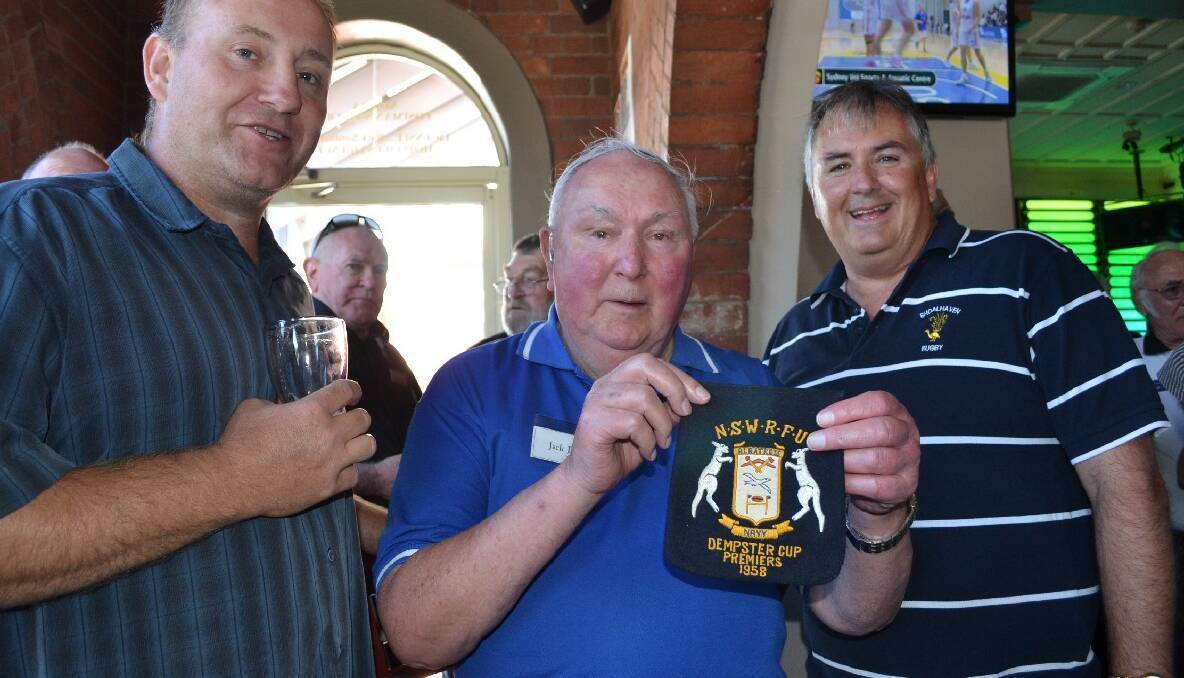 One of the oldest former players to attend the Albatross Rugby reunion, Jack Dun (centre) shows of his premiership patch after winning the 1958 Dempster Cup with Matt Hyam (left) and Peter Dun.