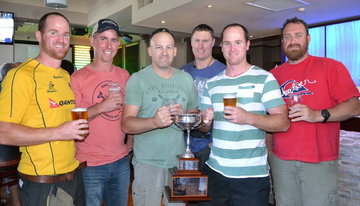 Some of the silverware the Albatross Rugby teams have won over the years was on display at the reunion (from left) David Sproule, Scott Hay, Jason Cook, Shaun Megahey, Mark Sproule and Craig Gurney.