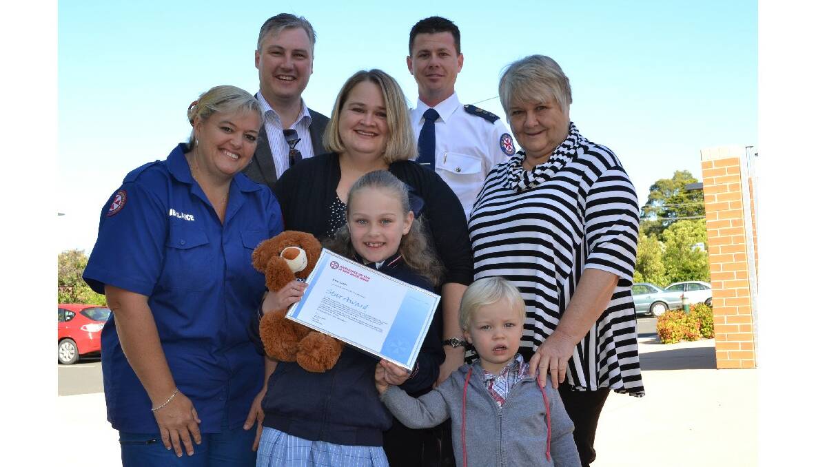 Nowra Anglican College student and NSW Ambulance Star Award recipient Elsa Guile with her proud parents Andrew and Natalie, younger brother Ollie, and grandmother Colleen Edwards with Southern Control call taker Janelle Gaskin and NSW Ambulance Chief Superintendent Joel Bardsley.