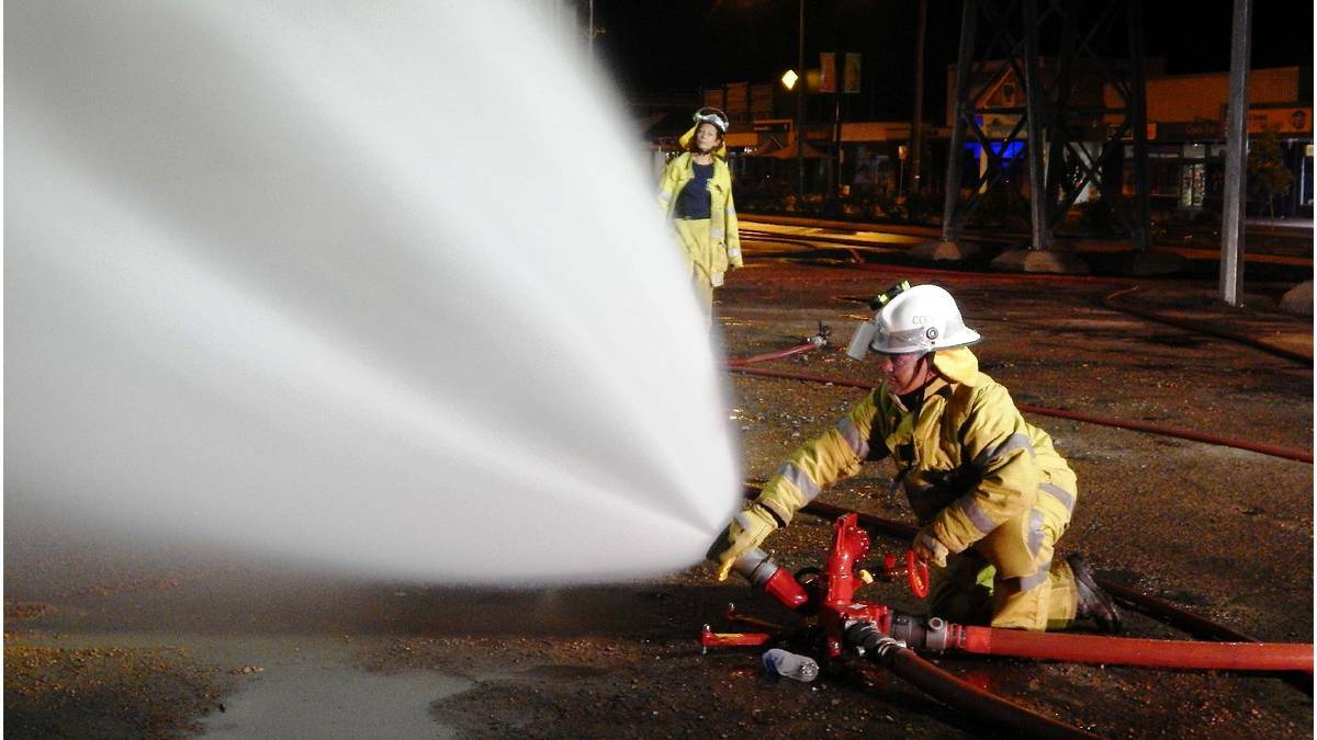 Collie firefighters used a night-time exercise in the CBD to test out their new ground monitor, a piece of equipment able to shoot 3000L a minute. Photo: Angela Clutterbuck/Collie Mail.