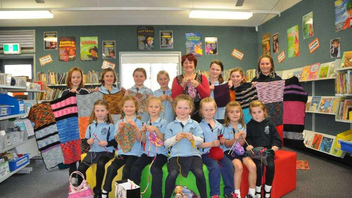 MERIMBULA: Needles fly as Pambula Public School’s knitting circle hurries to finish blankets they will donated to the aged care facility Imlay House. 