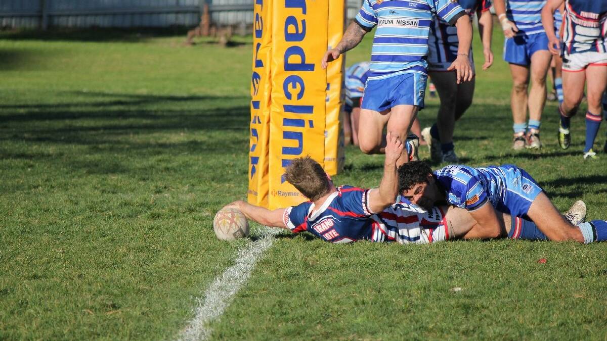 BEGA: Bega Rooster Lachlan Sund reaches for the try line in Sunday's Group 16 rugby league contest over competition heavyweight Moruya.