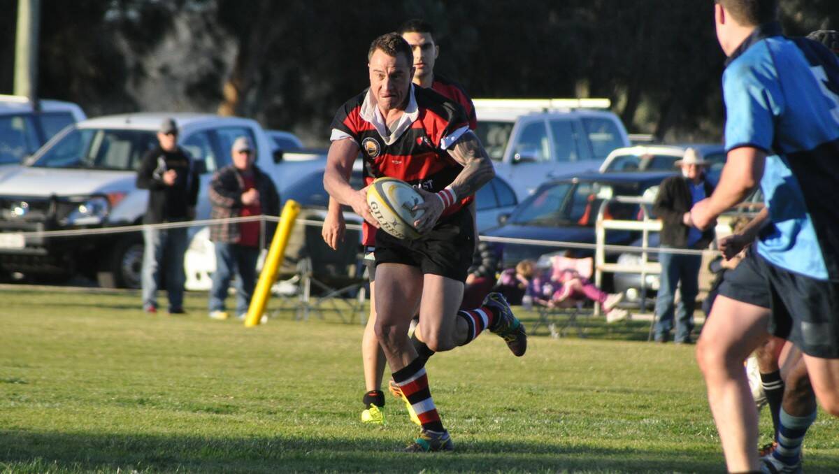 BATEMANS BAY: Bay Boars fullback Cory Maddison goes on a run in his side's 21-15 South Coast Rugby Union grand final win over the Broulee Dolphins at Hanging Rock on Saturday. PHOTO: Dean Benson.