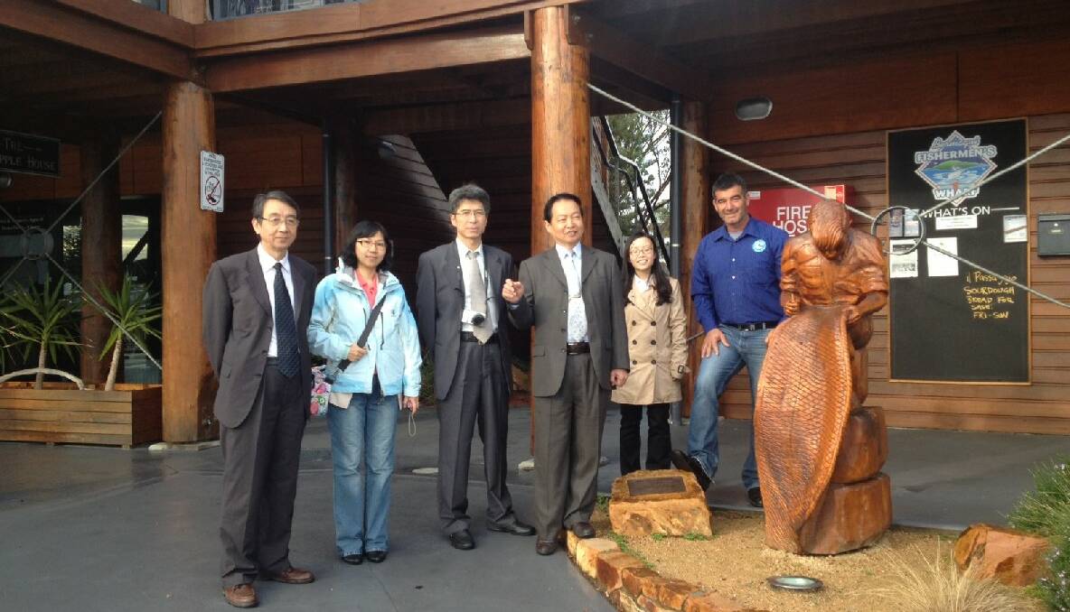 BERMAGUI: Representatives from the General Station of Administration on Rural Cooperative Economy, Ministry of Agriculture, People’s Republic of China with their translator   Li Xi and Bermagui Fisherman’s Cooperative managing chairman Rocky Lagana.
