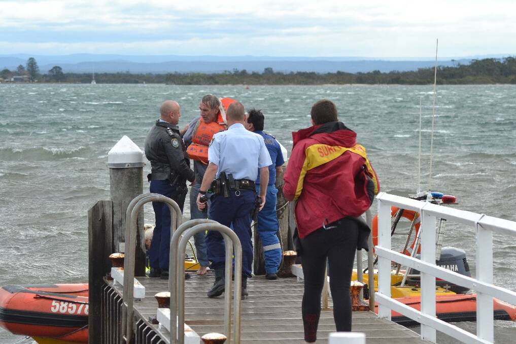 Emergency services met the man at Crookaven Regional Boat Ramp after he was pulled from the water.