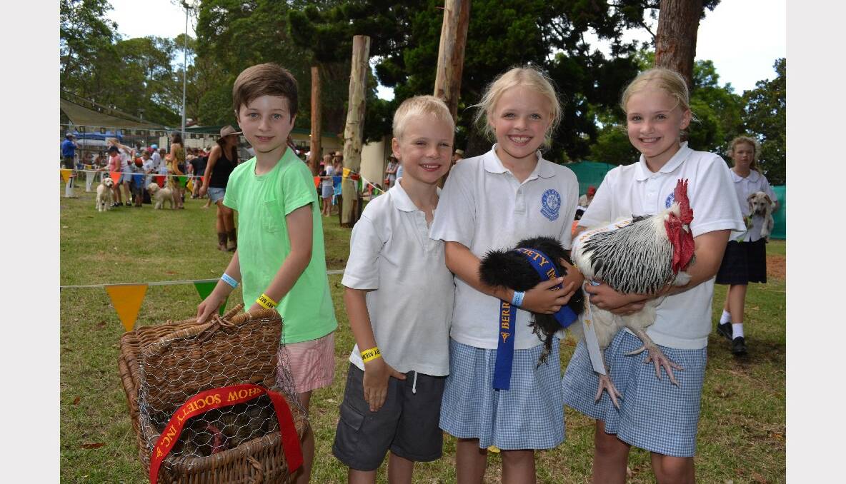 Saxon Brittain-George, Tobias, Gwendolyn and Milly Eyland with their award-winning chooks at the Berry Show.
