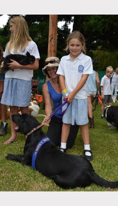 Debbie and Olivia Searle with their dog Chilli who won the dog with the longest tail contest at Berry Show.