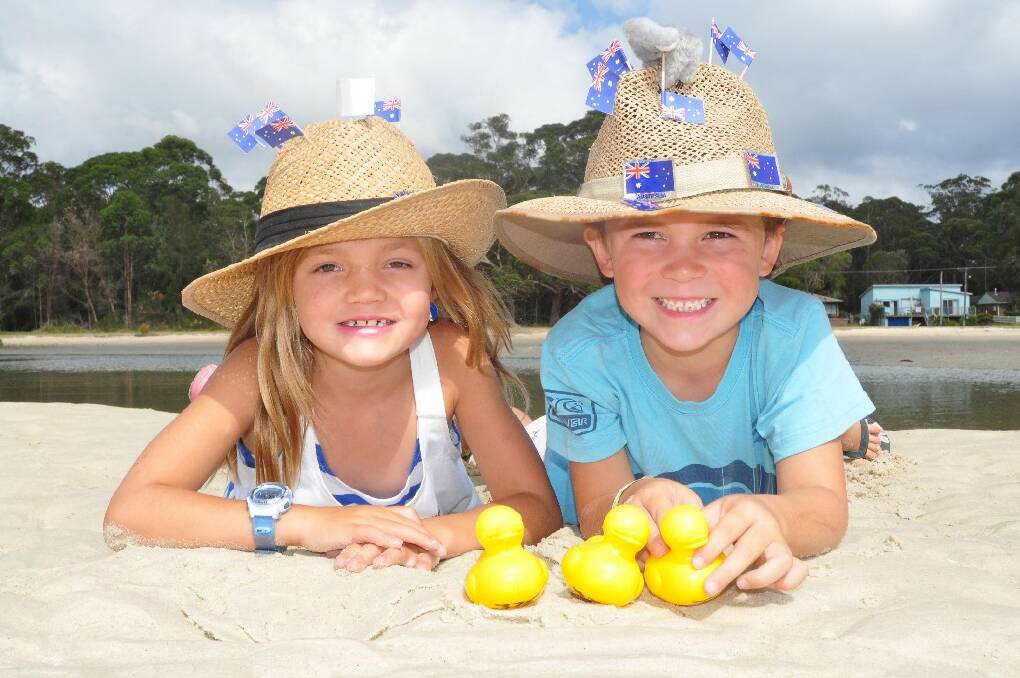 Siblings Jaxon and Ava O'Brien get ready for Saturday's duck derby and Aussie hat competition at Moona Moona Creek reserve.