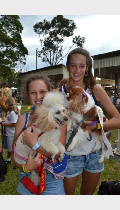Jayde Bennett from Falls Creek with Poppy who acme second in the best groomed dog contest, with Tilly Adamson from Brundee with Charlie who place third at Berry Show.