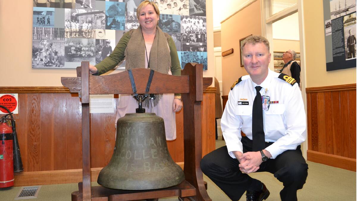 PRIDE OF PLACE: Fleet Air Arm Museum collections curator Ailsa Chittick and the head of the training support Section at HMAS Creswell Lieutenant Commander James Pateman with the historic HMAS Creswell bell which is now on display at the RANC Historical Collection.