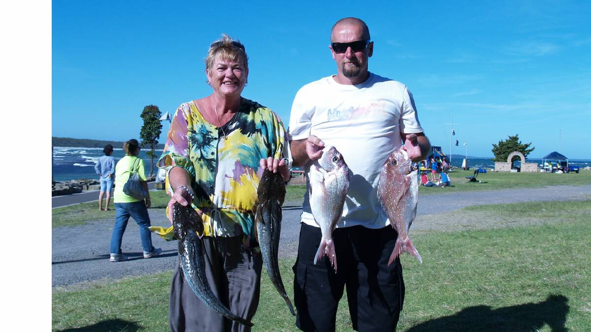 GREAT START: New Huskisson RSL Amateur Fishing Club members Christine Wray and Jason Smith with part of their prized catches.