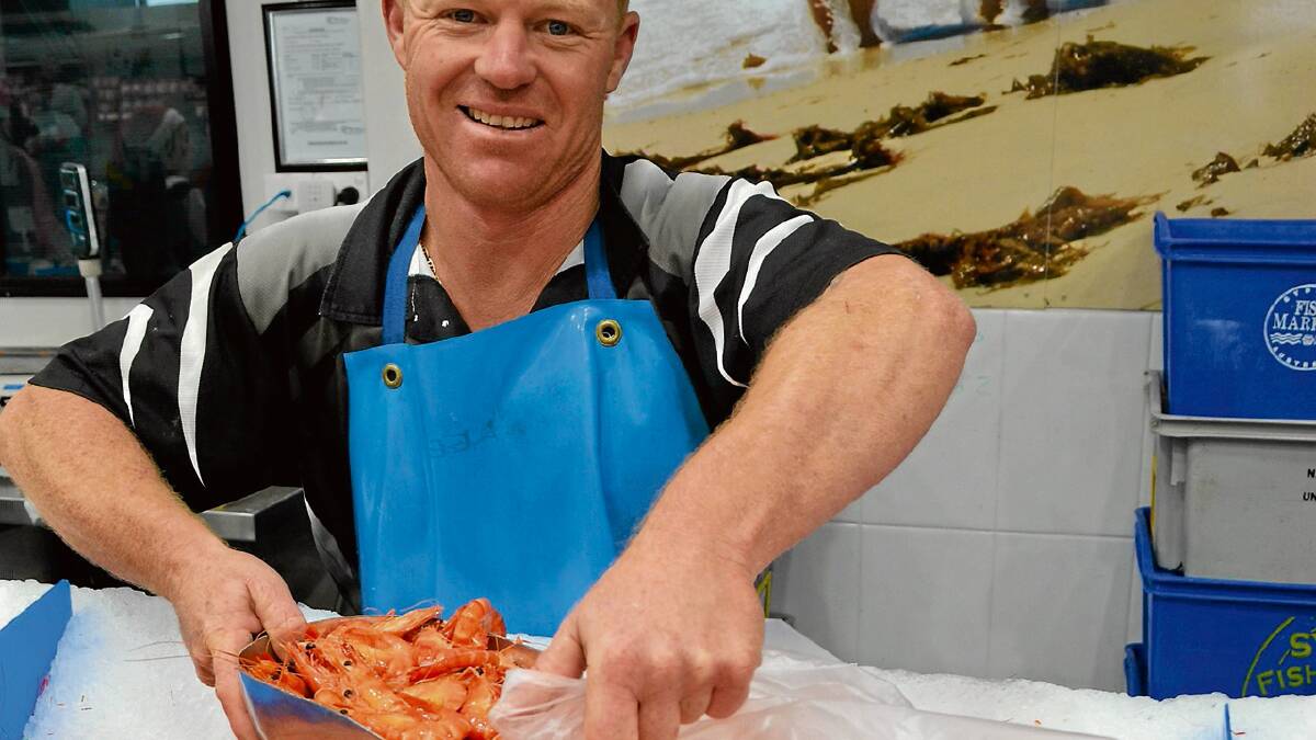 BY THE TON: Nowra Fresh Fish and Meat Market staff were busy dishing up the eight to nine tonnes of prawns already sold for Christmas feasts.