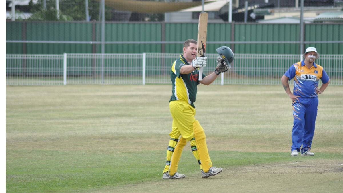 GREAT MOMENT: Simon Schmotz responds to the applause of his Ex-Servos team mates after bringing up his century on Saturday. Photo: PATRICK FAHY 