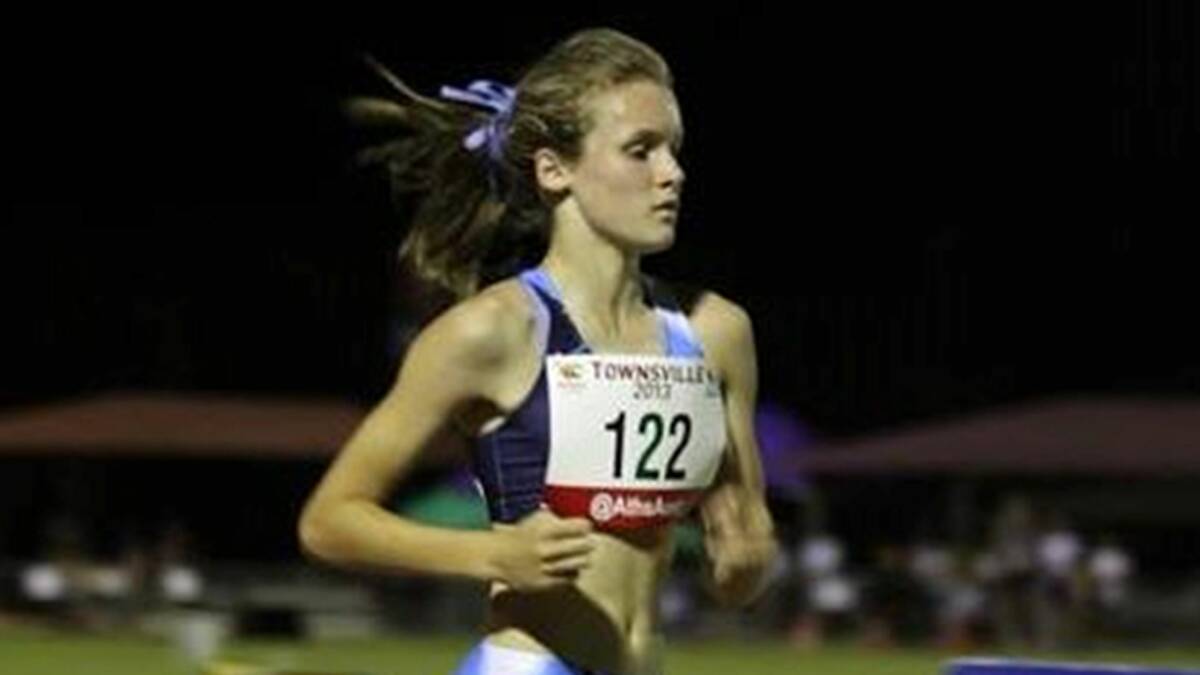 GOLDEN GIRL: Shoalhaven Heads runner Rosie-May Davidson in pursuit of her gold medal in the steeplechase at the Australian All Schools in Townsville last week.