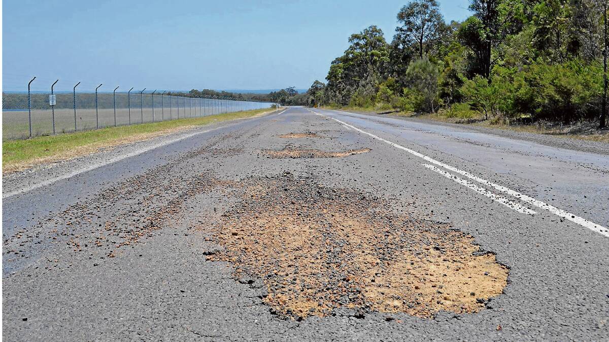 DANGER ZONE: The surface on Braidwood Road crumbles on a daily basis.