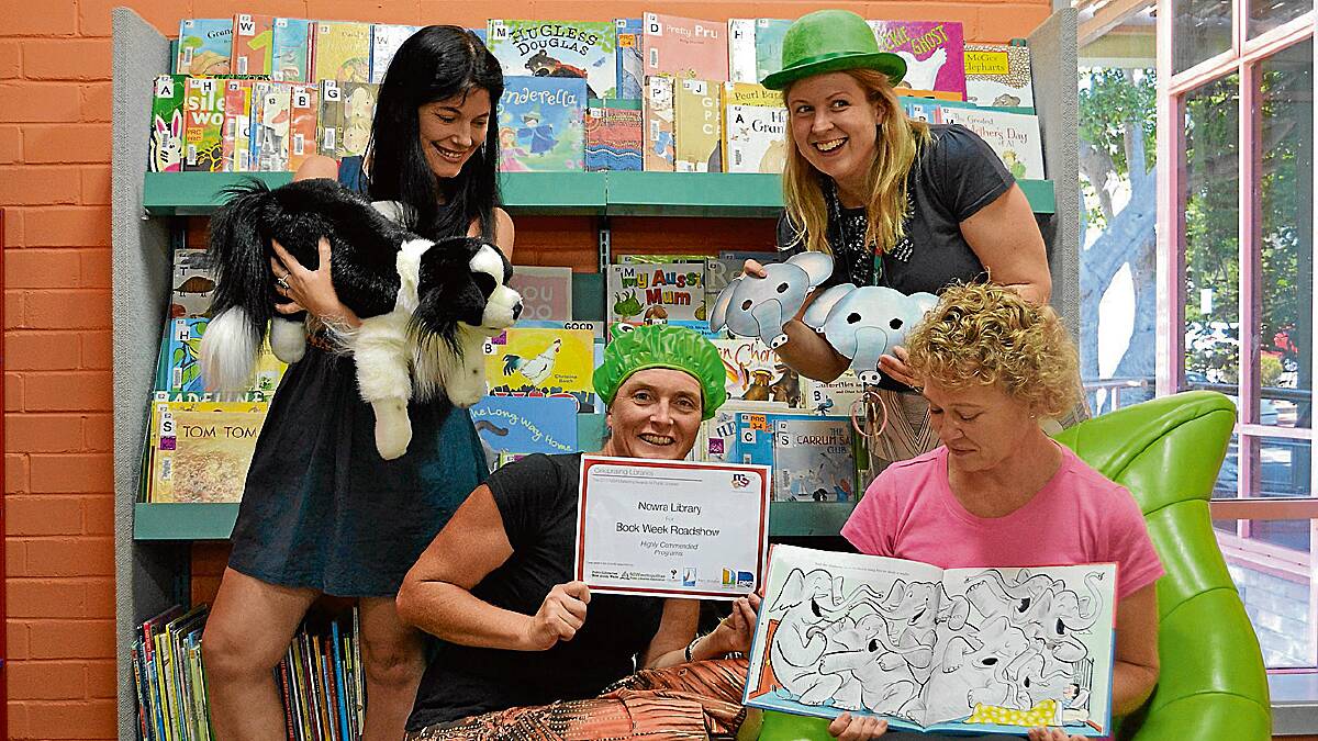 PLAYTIME: Performing librarians Cher Murphy, Nicole Lonesborough, Jessica Green and Derrilin Marshall (and the library dog), who won a NSW Public Libraries Marketing Award for their Book Week Roadshow. 
