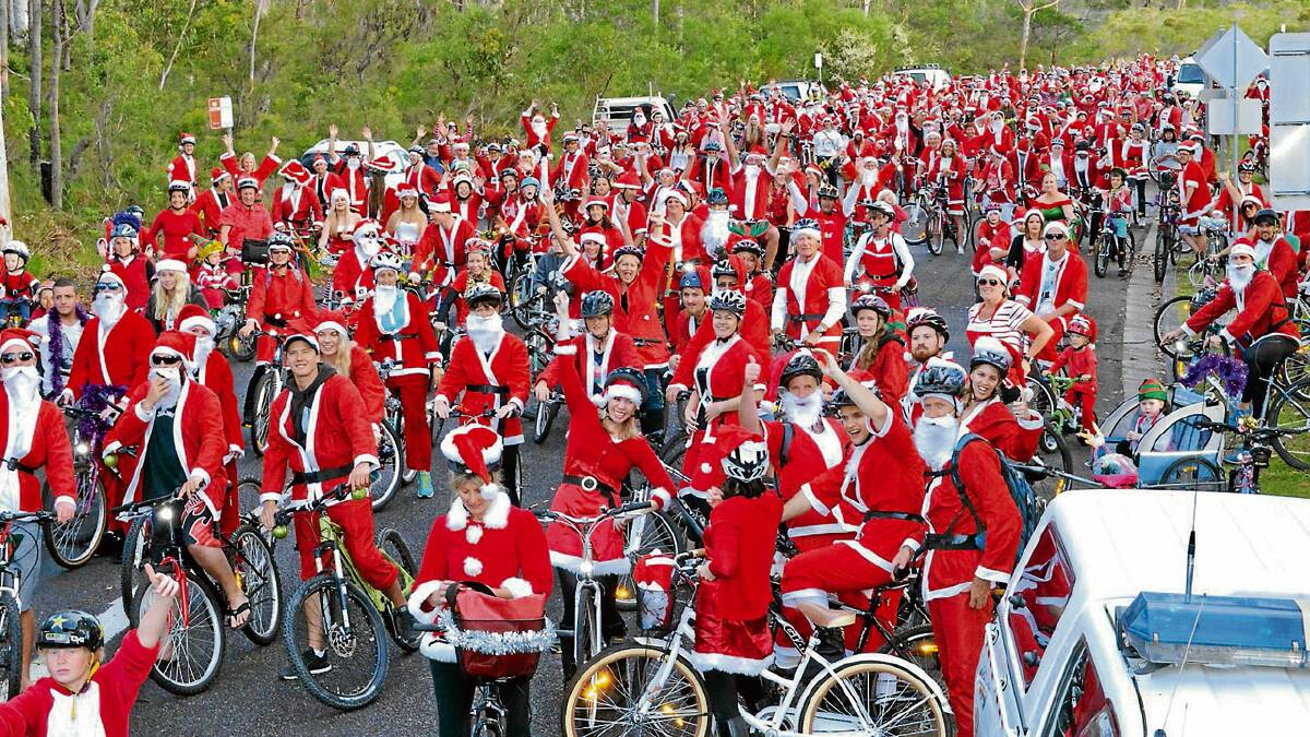 RED SEA: Hundreds of Santas show up for the annual Charity Santa Ride in Vincentia on Thursday, raising money for the local fire brigade and for a touch of pre-Christmas fun.