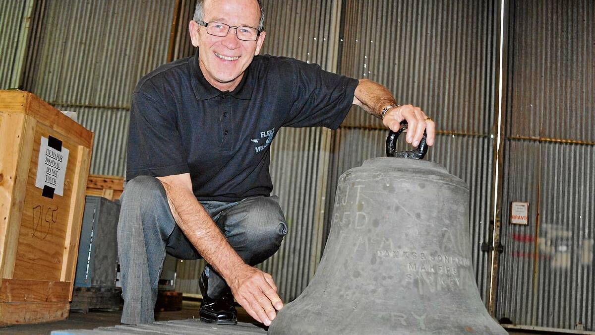 HISTORY MYSTERY: Fleet Air Arm Museum manager Terry Hetherington with the historic HMAS Creswell bell.